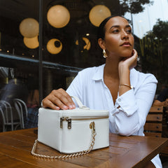 Organizational cosmetic case with compartments and gold detailing